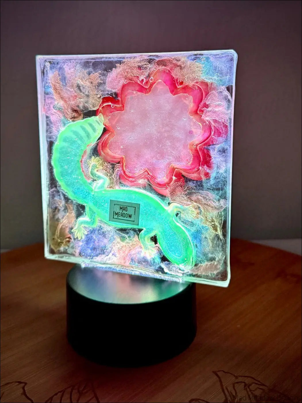 Whimsical glowing gecko resin lamp with vibrant crimson bloom and warm golden RGB color change night light