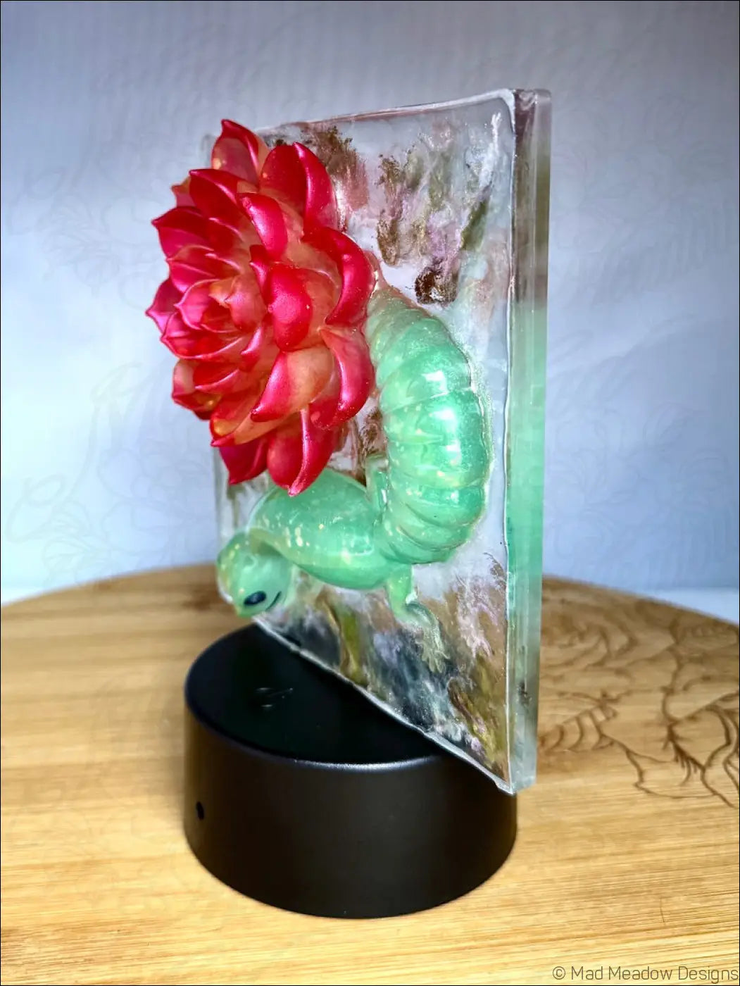 Translucent resin whimsical glowing gecko night light with vibrant crimson bloom and warm golden rgb color change glow